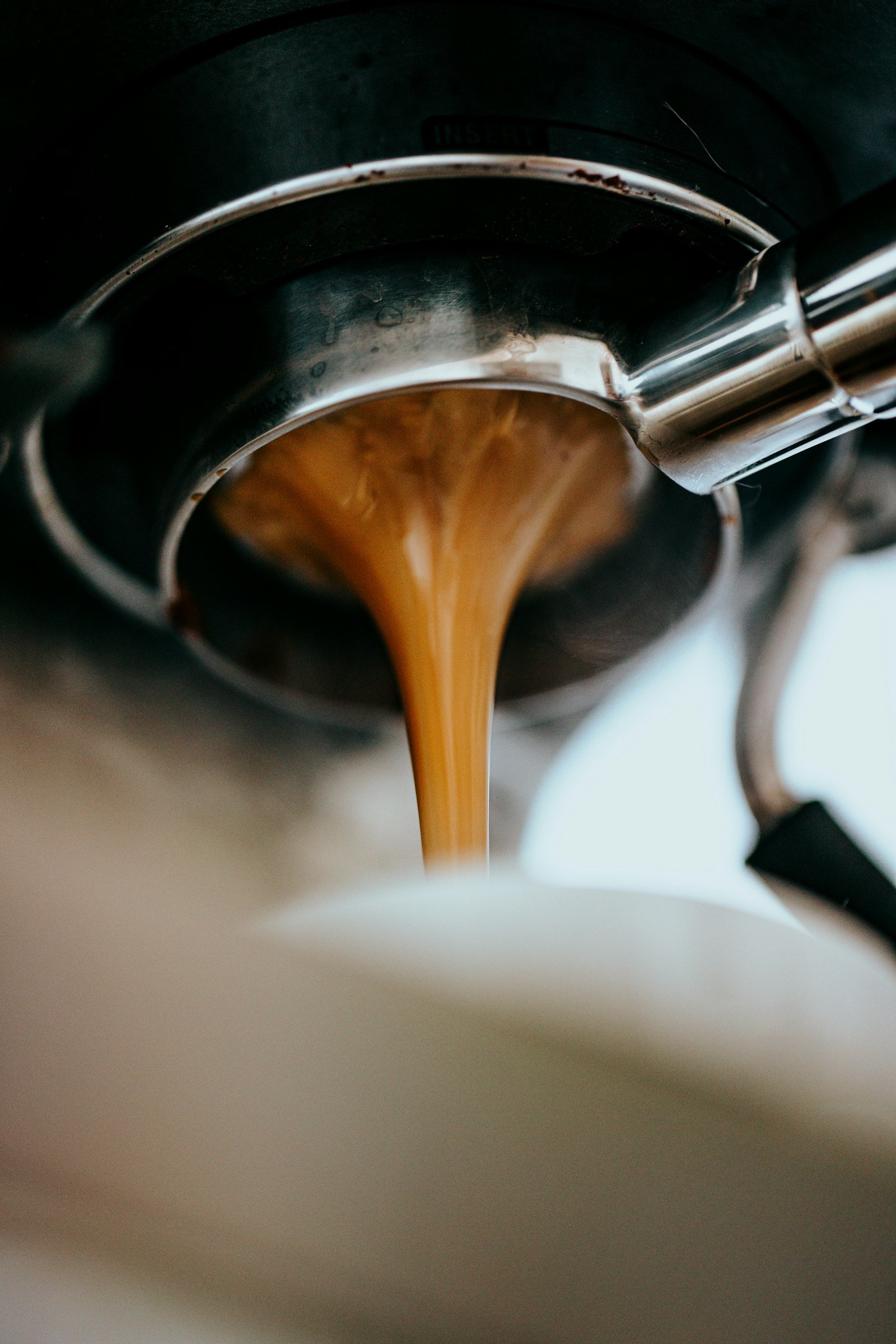 Espresso pouring from a portafilter